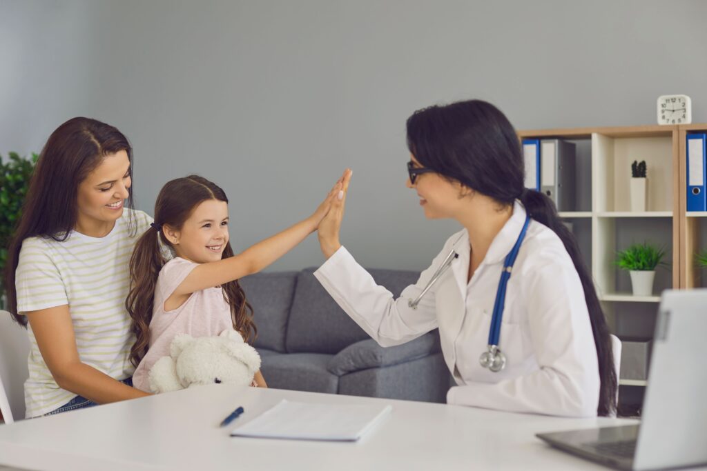 healthcare provider with mother and daughter